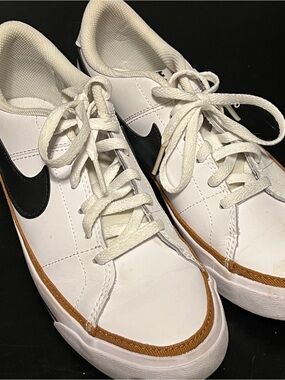 Nike White Sneakers with Black Swoosh and Brown Trim